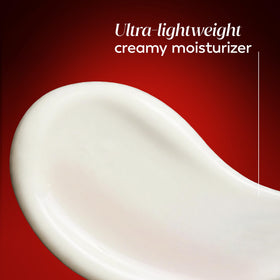 Olay pouring small amount of serum on hand for lightweight feel