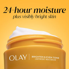 Olay application on model cheek showing even coverage and glowing effect