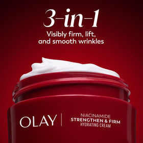Olay 2 oz jar beside a coin to show compact travel-friendly size
