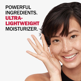 Olay product held in hand to show compact 1.7 oz size and portability