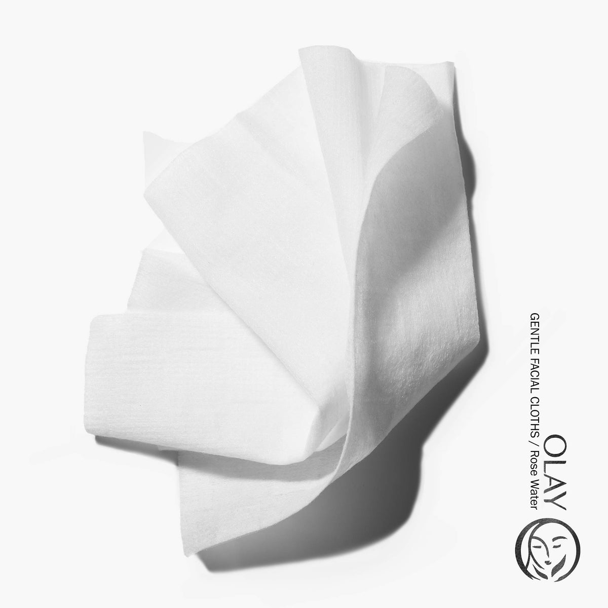 hand holding Olay wipe for scale showing large cleansing surface for face