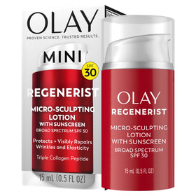 Olay jar beside a coin for scale showing compact travel-friendly size
