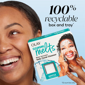 Olay melt beside hand to show compact size and single-use portioning