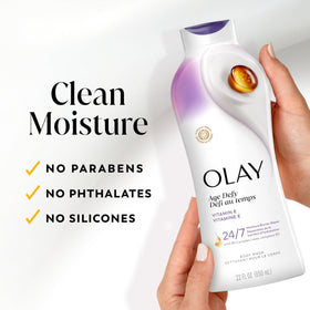 Hand holding Olay bottle to show scale and travel-friendly large size benefit