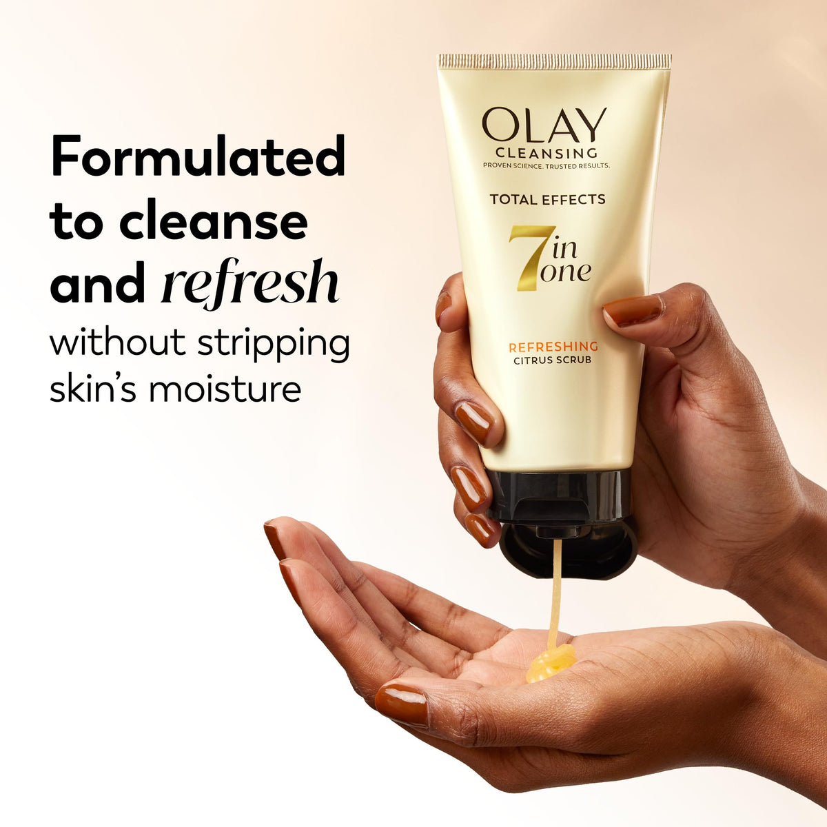 Product being applied to hand showing Olay total effects gentle texture