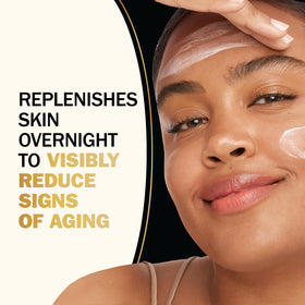 Olay Total Effects cream on fingers illustrating lightweight spreadability benefit