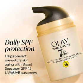 Olay Total Effects being applied to fingers showing lightweight spreadability