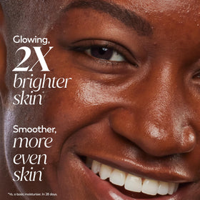 Olay trial jar in hand showing travel-friendly size and on-the-go convenience
