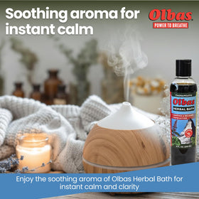 Hand holding Olbas bottle to show 8 fl oz size and scale