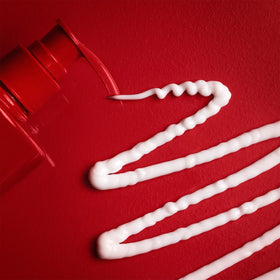 Old Spice pump dispensing lotion highlighting easy one-handed use benefit