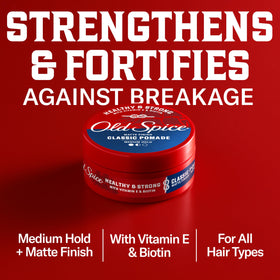 Applying Old Spice pomade to hands for even distribution and workable hold