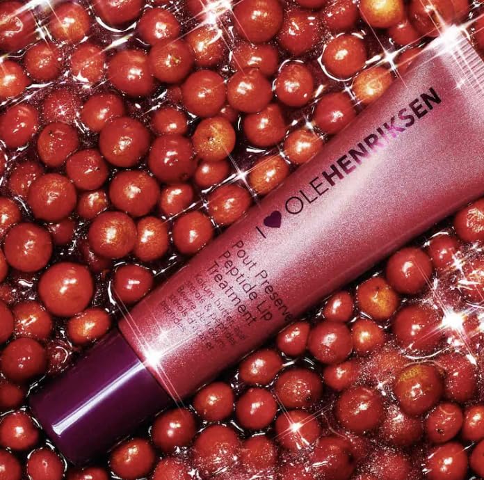 Ole Henriksen applied on lips in lifestyle shot giving hydrated, plumper-looking smile