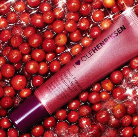 Ole Henriksen applied on lips in lifestyle shot giving hydrated, plumper-looking smile