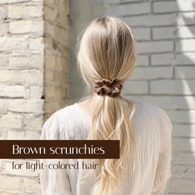 OLESILK on model in ponytail demonstrating reduced frizz and shine
