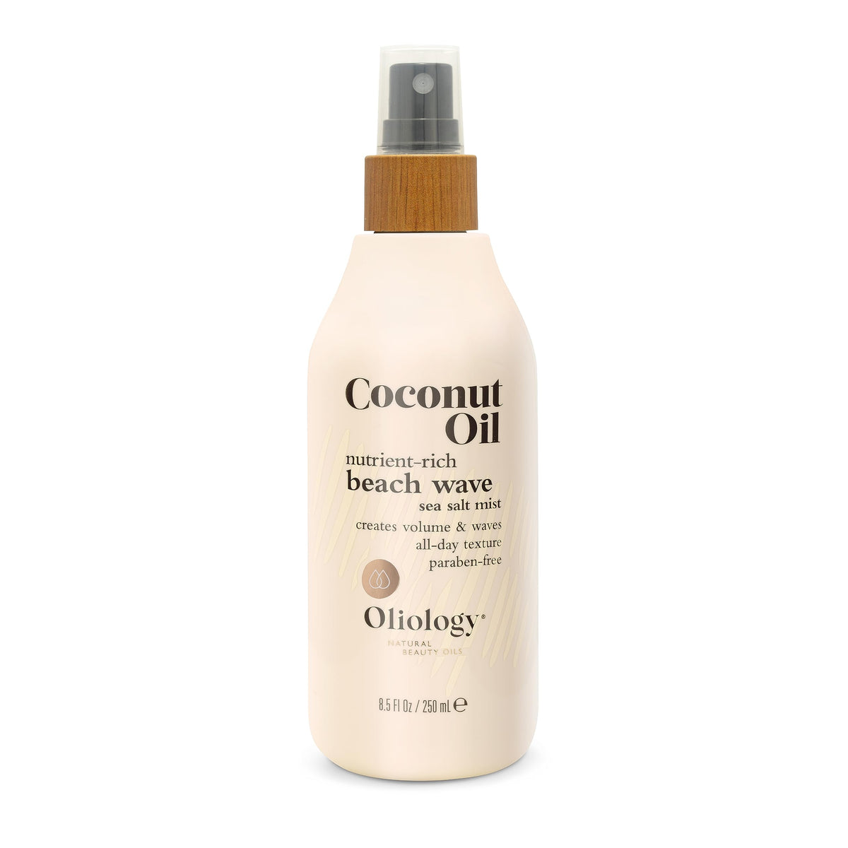 Model with beachy waves styled by Oliology mist for effortless day-long texture