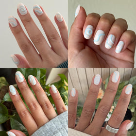 Olive & June pressing on a nail to show quick secure hold benefit