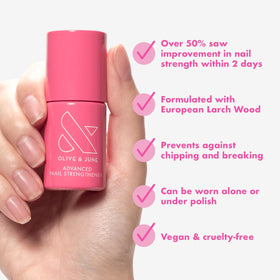 Olive & June brush applying clear strengthener for quick, even coverage benefit
