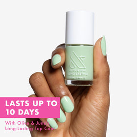 Olive & June brush close-up highlighting wide fan brush for easy application
