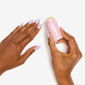 Olive & June mini cuticle serum applicator dispensing drop to hydrate cuticles quickly