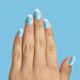 Olive & June kit contents with file, buffer, and prep pad for a complete mess-free mani