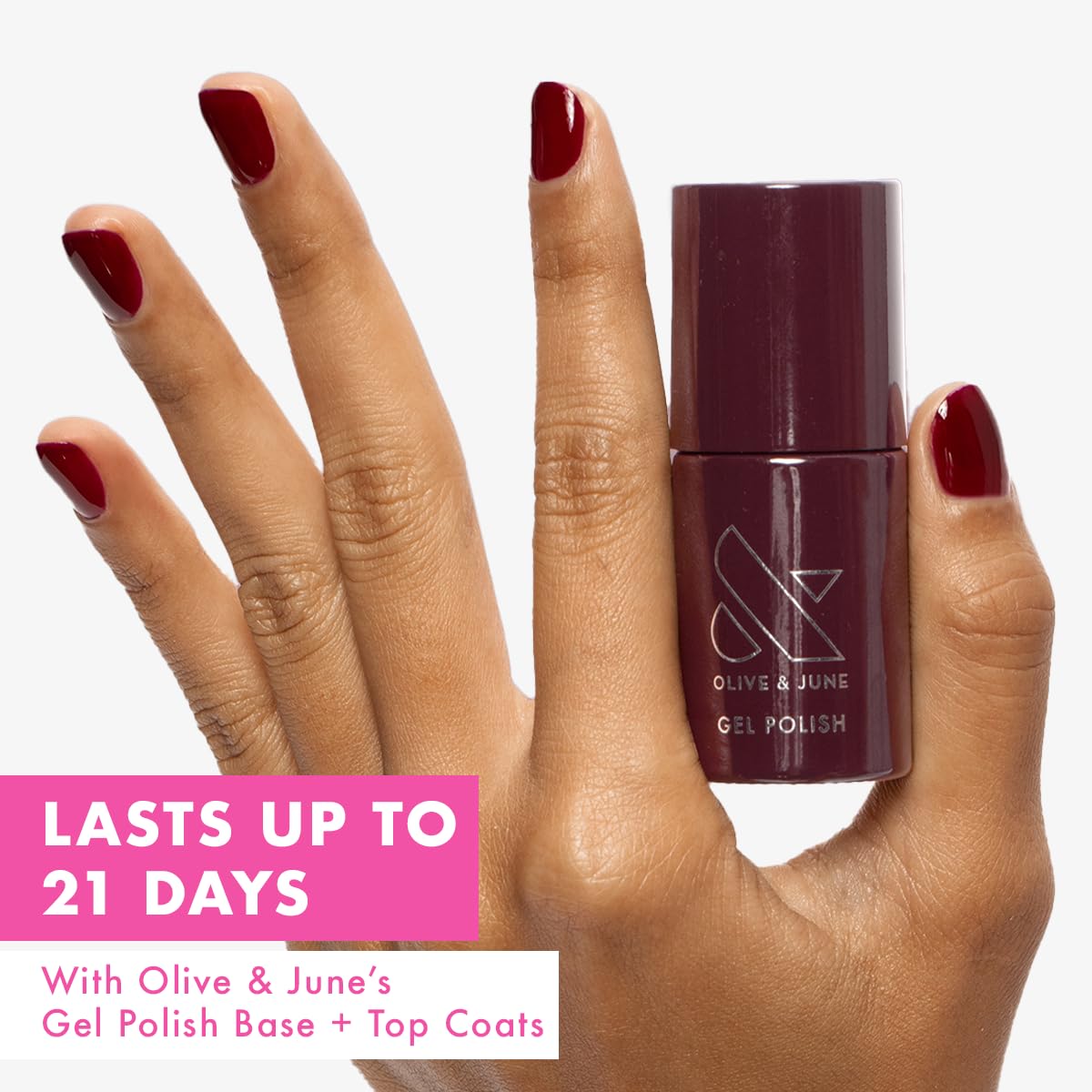 Olive & June brush lifting Obsessed Dark Ruby showing smooth application benefit