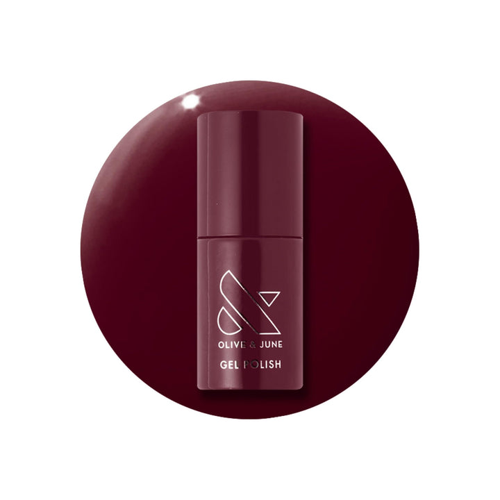 Olive & June bottle front packaging showing deep ruby shade and label benefits