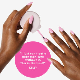 Person painting nails with non-dominant hand using Olive & June Poppy for improved control