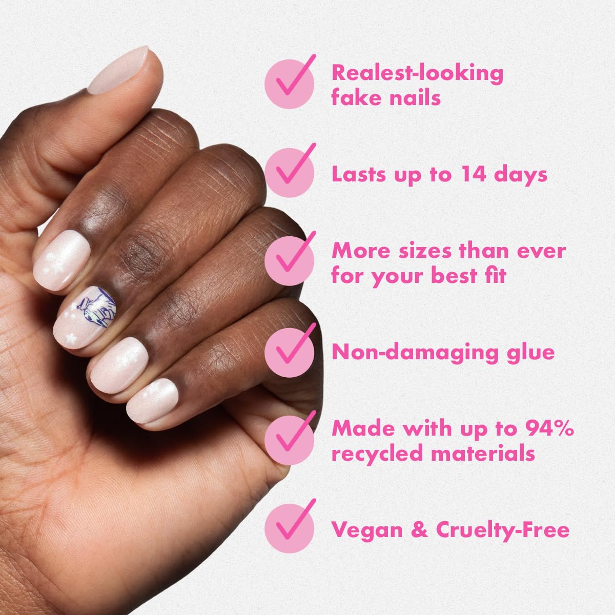 Olive & June press-on held between fingers showing natural curve and secure fit benefit