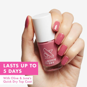 Olive & June wide fan brush close-up delivering even coverage for quick application