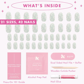 Olive & June nails next to ruler for scale showing available sizes and fit options
