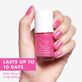 Olive & June wide fan brush spreading Signet Pink for smooth, fast application