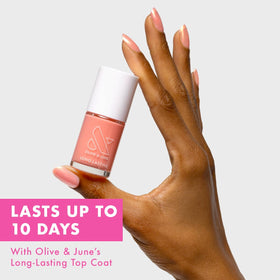 Olive & June wide fan brush spreading smooth color for easier application