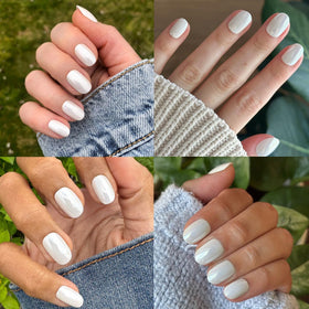Olive & June hands wearing white chrome nails demonstrating salon-quality finish