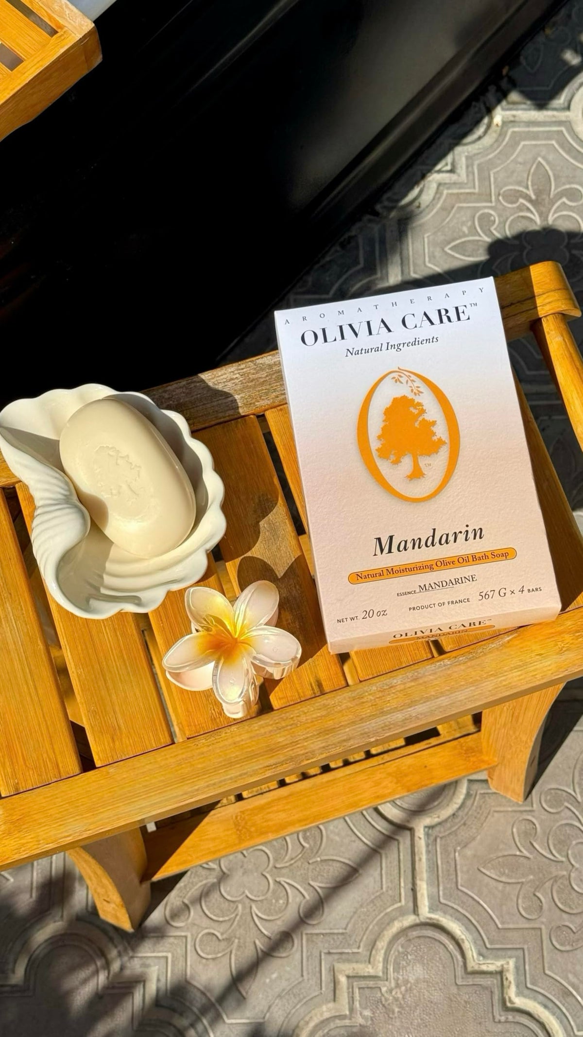 Olivia Care soap held in hand to show bar size and travel-friendly convenience
