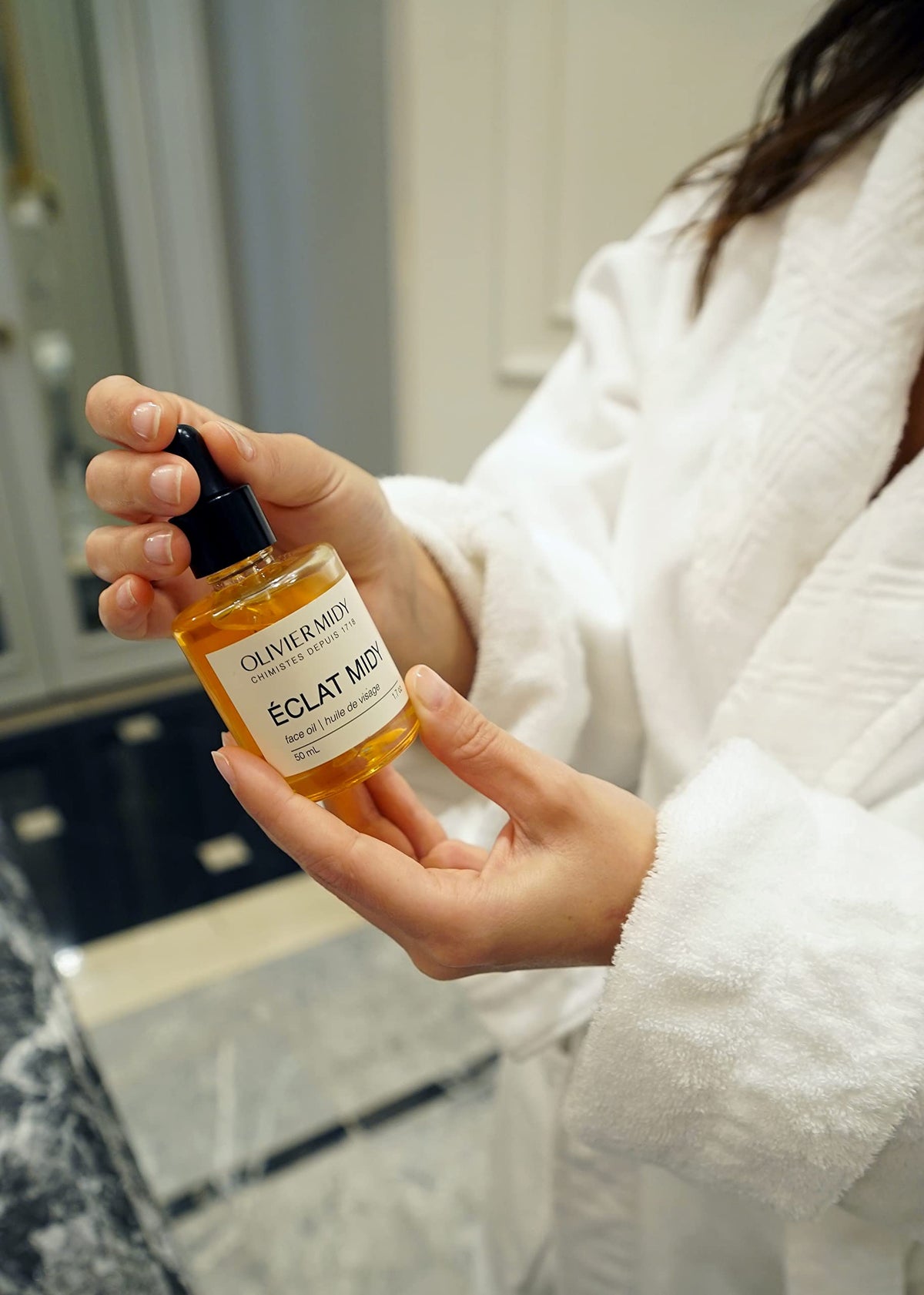 Olivier Midy applied in morning routine showing smooth layering under sunscreen