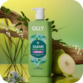 OLLY CLEAR bottle in hand to show 17 fl oz size and convenient daily use