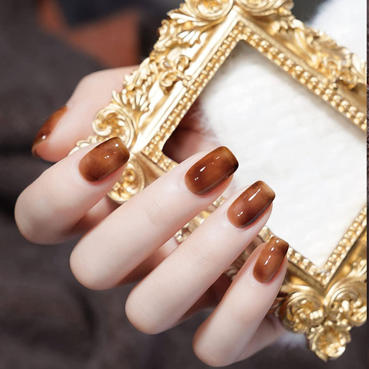 Omainy on-nail swatch hand demonstrating cured gloss and long-wear aesthetic benefit