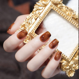 Omainy on-nail swatch hand demonstrating cured gloss and long-wear aesthetic benefit