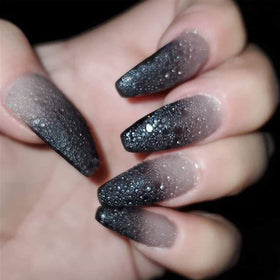 Omainy purple-to-red thermal transition on nail tip highlighting dramatic color change