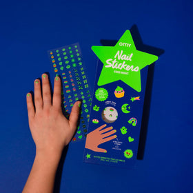 Omy kids at a party wearing glowing nails to enhance celebration fun
