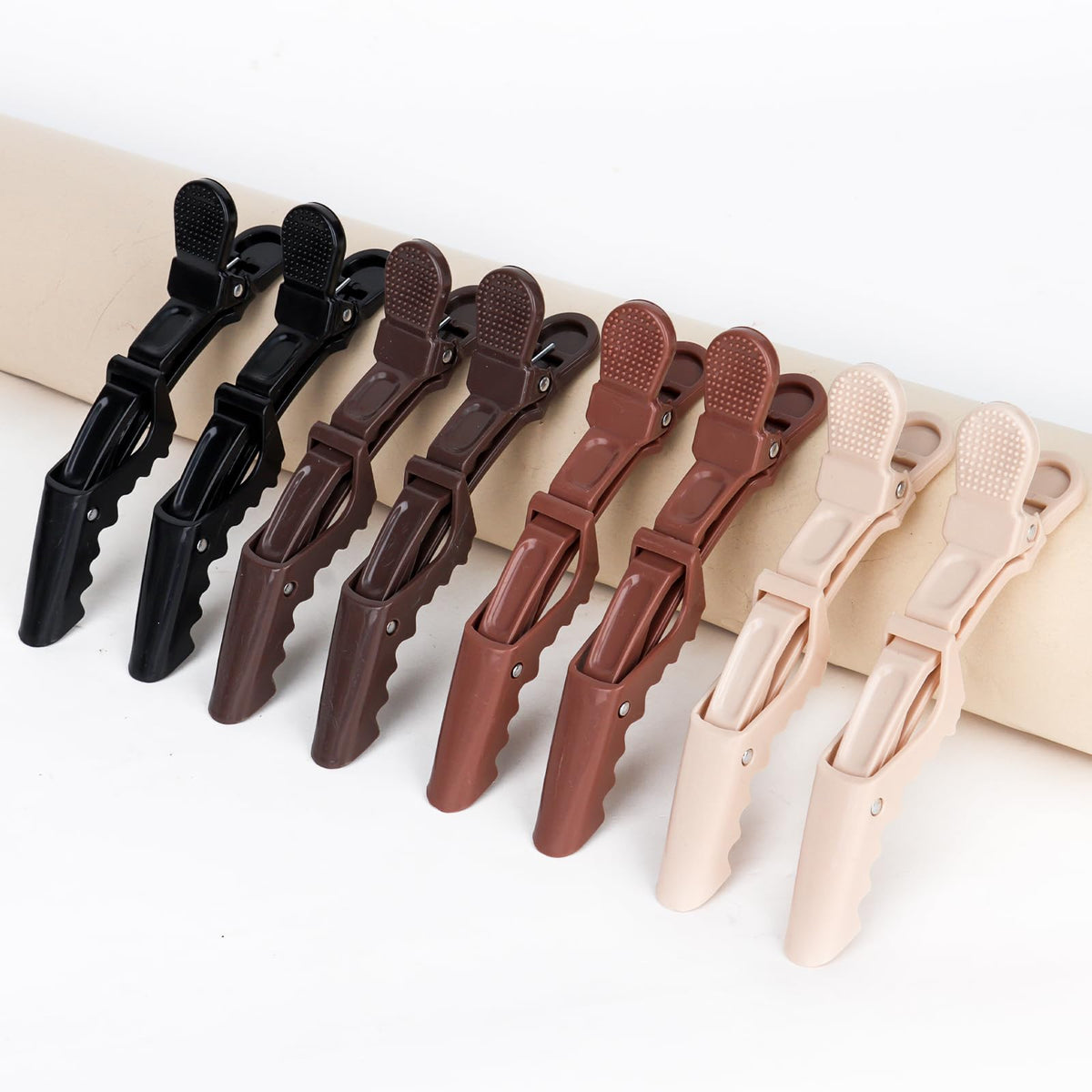 Ondder clip securing hair during coloring to keep sections organized