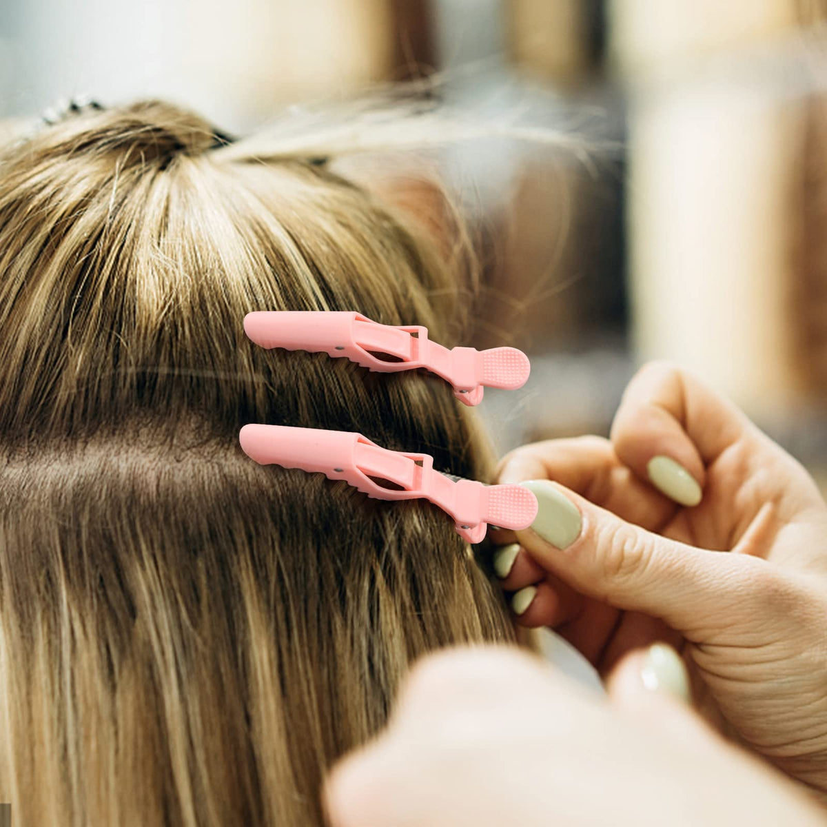 Ondder clips in use securing hair sections for coloring and cutting with ease