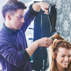 Ondder clips used by stylist to section hair for precise cutting and coloring