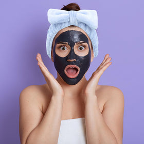Ondder headband worn while applying face mask keeps hair back