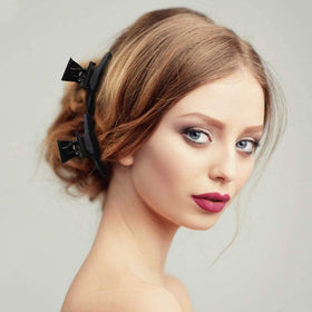 Ondder clip gripping wet hair securely for cutting and coloring control