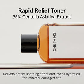 ONE THING bottle open with toner pouring to show lightweight, fast-absorbing formula