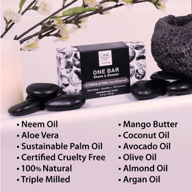 One With Nature sandalwood oils and botanicals laid out to show nourishing ingredients