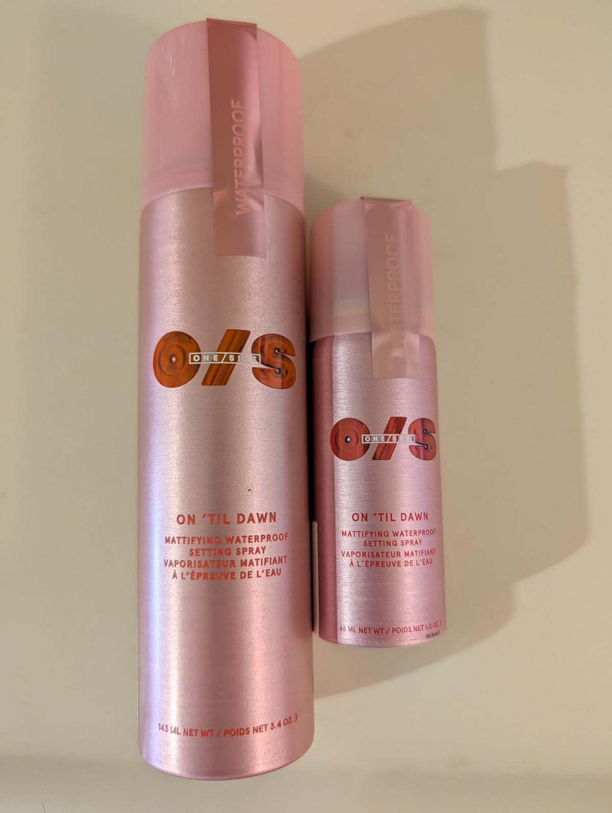 ONE/SIZE spray applied on model outdoors showing longwear and humidity resistance