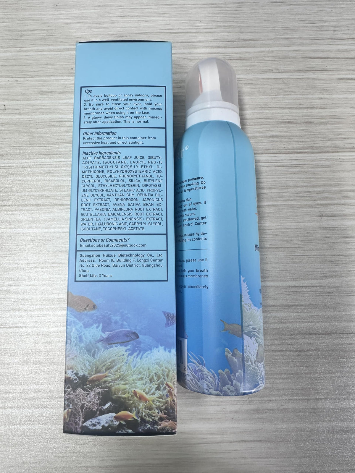 ONSART family at beach using spray for convenient reef-safe sun care