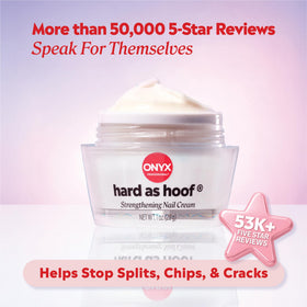 Applying Onyx Professional cream to a fingernail to strengthen and hydrate damaged nails